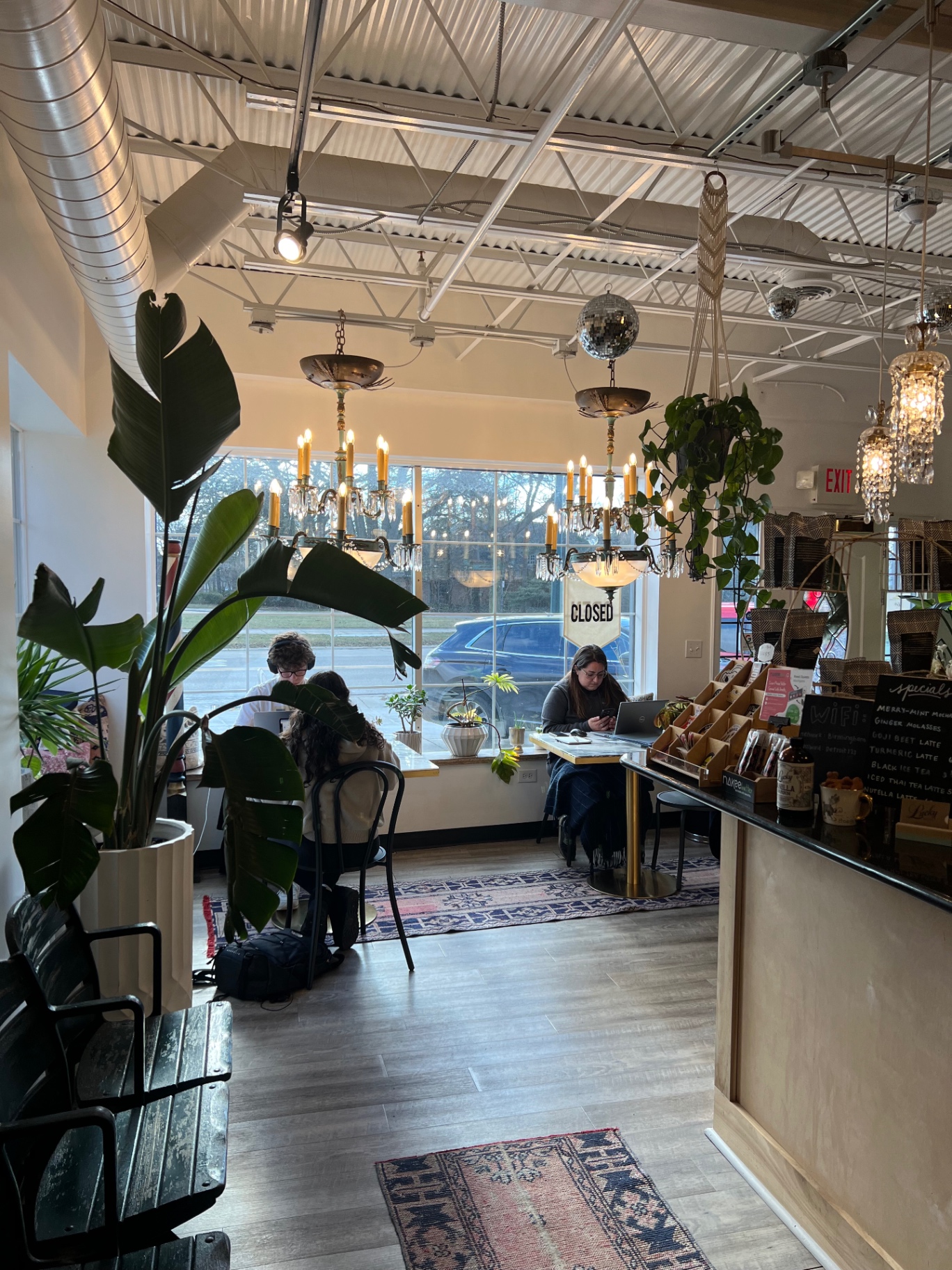 Lucky Detroit coffee shop inside the Detroit Barber Co building at 1728 W Maple Rd, Birmingham, next to Holiday Market